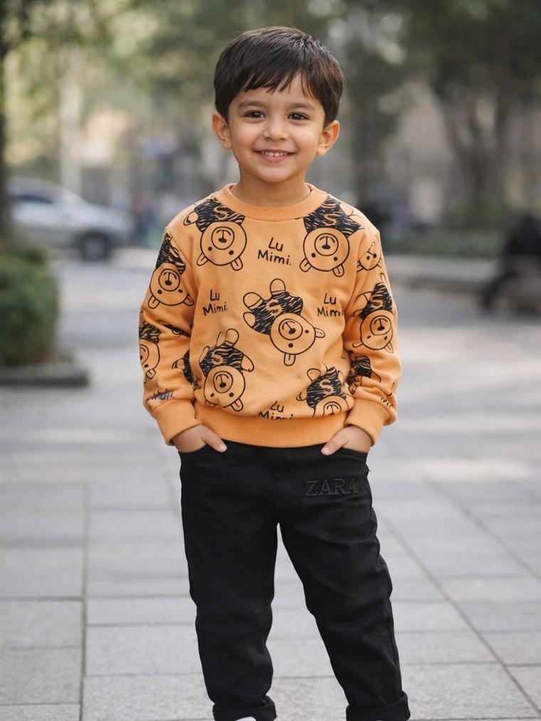 Boy wearing an orange printed sweatshirt